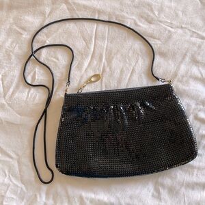 9”x5.5” Black party purse with gold accent trim